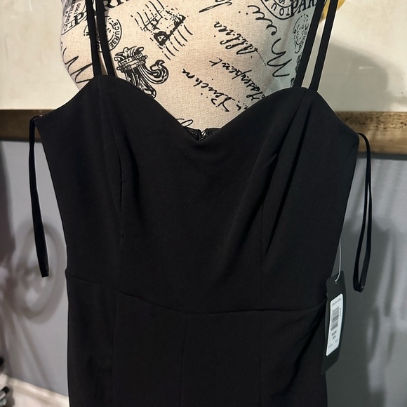 Bebe NWT jumpsuit. Black. Sexy slits up leg. Has stretch. Xs - Picture 3 of 6